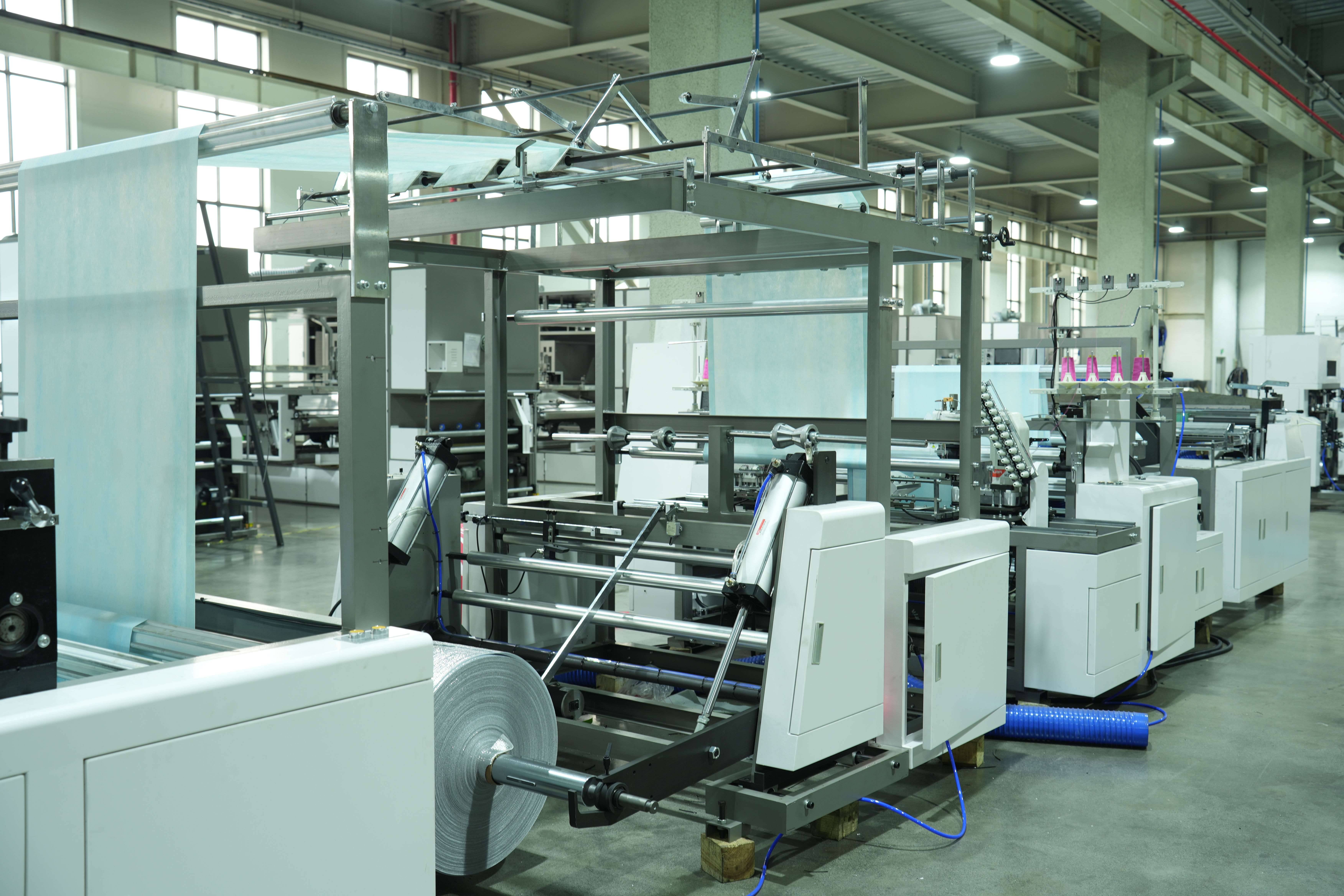 ONL-XG1200 การเย็บและตัดเย็บแบบสองด้านที่ไม่ได้ทอ
